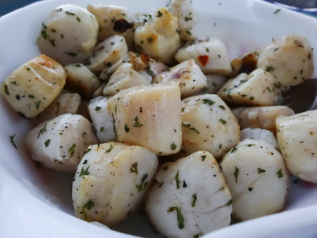 A bowl full of grilled scallopsの写真素材