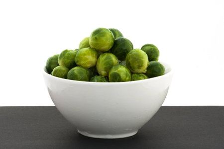 Fresh brussels sprout in a bowlの写真素材
