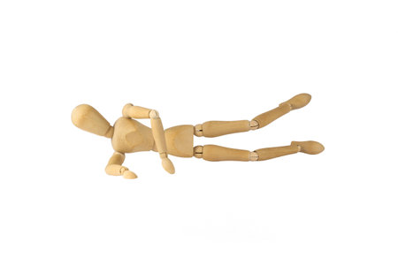 Wooden female figure is doing exerciseの写真素材