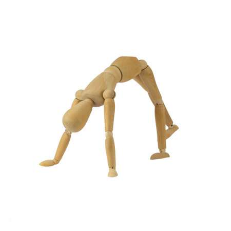 Wooden female figure is doing handstandの写真素材