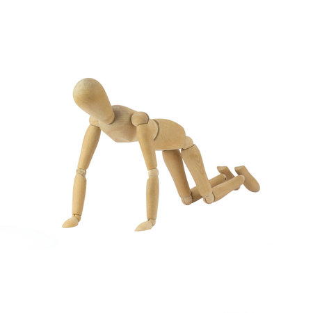 Wooden female figure is doing pushupsの写真素材