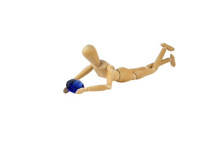 A wooden female doll is holding a blue diamondの写真素材
