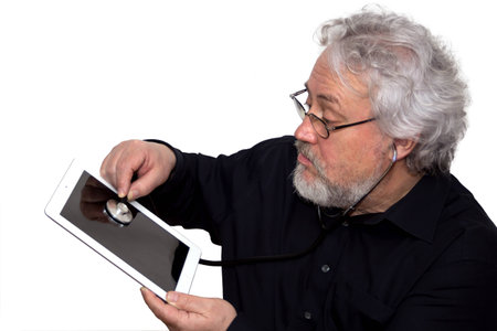 A senior is doing a diagnosis on a tablet pcの写真素材