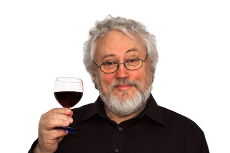 A senior is doing wine tastingの写真素材