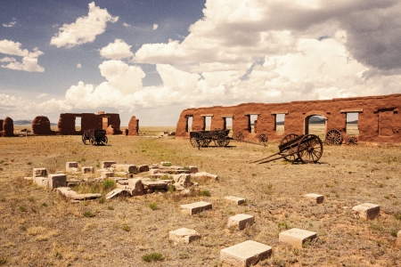 Vintage looking old picture of ruins and wagons at Fort Unionの写真素材