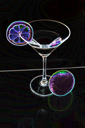 Martini glass with lemon slice and lemon from above in neon glowの写真素材