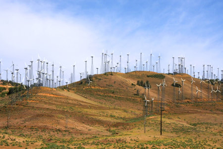 Horizontal shot of wind mills in California hillsの写真素材