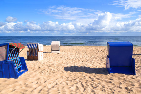 Empty roofed wicker beach chairs at the Usedom beachの写真素材