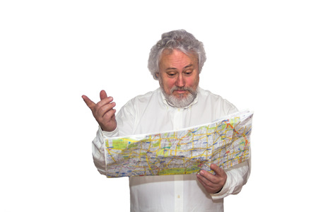 Senior is looking and holding a map in his hands and pointingの写真素材