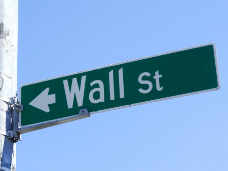 Street Sign Wall Street over blue skyの写真素材