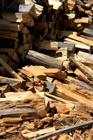 Freshly cut firewood logs in a stackの写真素材