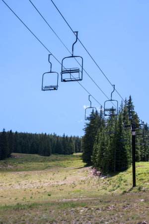 Empty ski lift seats in alpine summer landscapeの写真素材