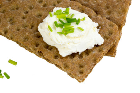 Macro shot of crispbread with cream cheese and chivesの写真素材