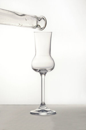 Pouring the Grappa into a glassの写真素材