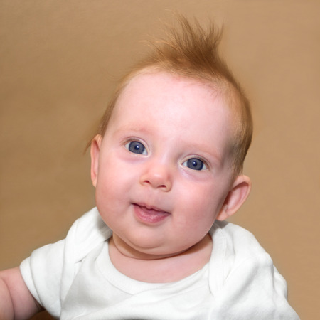 Square portrait shot of an almost four month old baby girlの写真素材