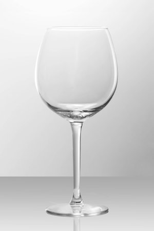 An empty wine glass on a shiny surfaceの写真素材