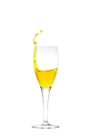 Isolated champagne flute with splashing liquidの写真素材