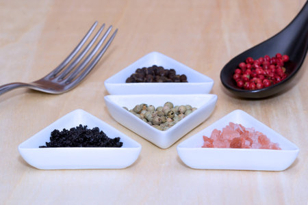 Variety of peppercorns and saltの写真素材
