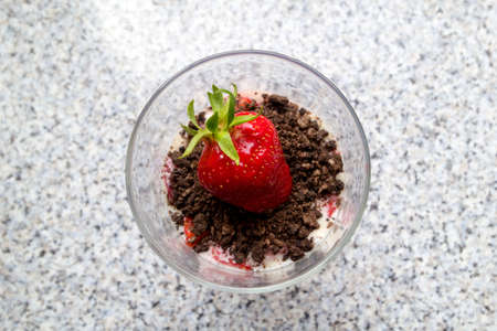 A dessert with strawberries an cream and cookies from aboveの写真素材