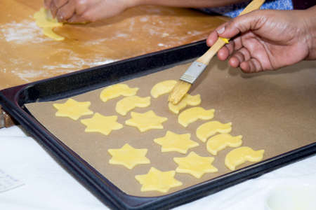 Preparing and baking cookiesの写真素材