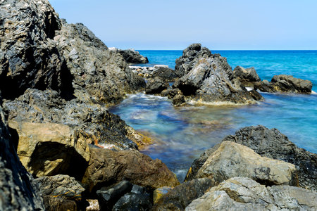 Long time exposure of surf at Elba rocky coast