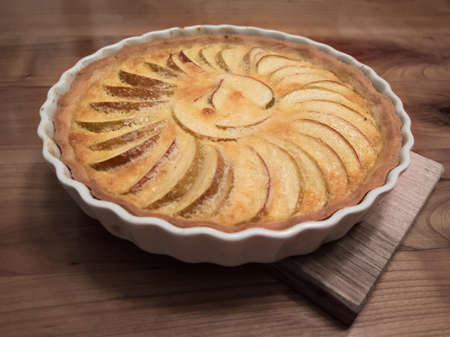 Fresh apple tarte on wooden table from slightly aboveの写真素材