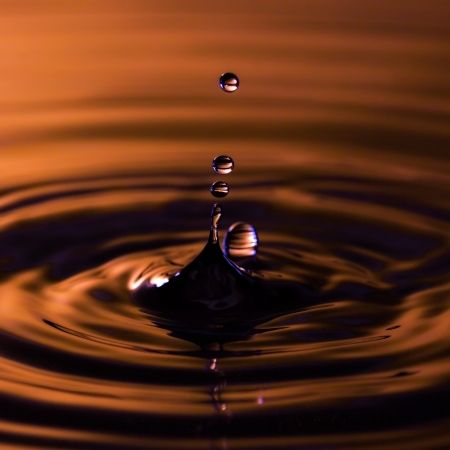 Photo of falling water droplet collisionの写真素材