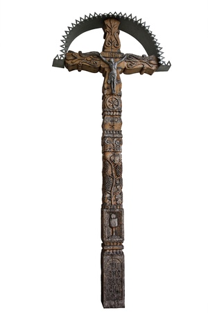 Photo of the old hand-carved and painted wooden crucifix isolated on a white background. This type of cross is typical for the region Detva Slovakiaの写真素材