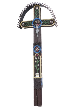 Photo of the old hand-carved and painted wooden crucifix isolated on a white background. This type of cross is typical for the region Detva Slovakiaの写真素材
