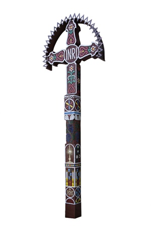 Photo of the old hand-carved and painted wooden crucifix isolated on a white background. This type of cross is typical for the region Detva Slovakiaの写真素材