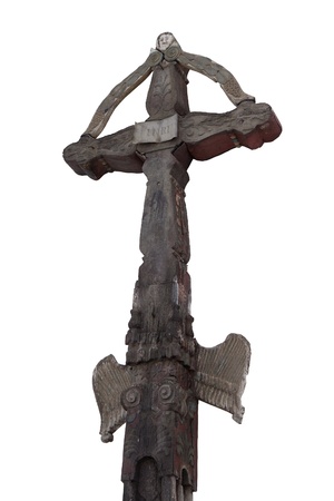 Photo of the old hand-carved and painted wooden crucifix isolated on a white background. This type of cross is typical for the region Detva Slovakiaの写真素材