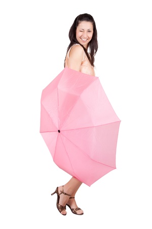 Brunette woman in white dress is covered in a pink umbrella, isolated on white backgroundの写真素材