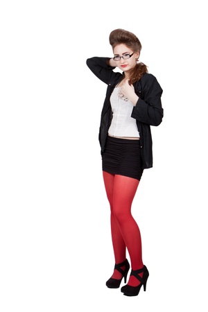 Teenage girl in black and red clothes in glasses adjusts her hair, isolated on white backgroundの写真素材