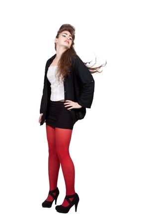Teenage girl in black and red dress with blow hair, isolated on white backgroundの写真素材