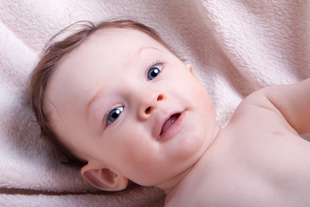 Portrait of a little baby boy with blue eyesの写真素材