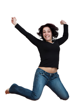 Woman leaping up, joyful and thrilled isolated on white backgroundの写真素材