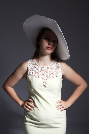 young lady in dress with white hatの写真素材