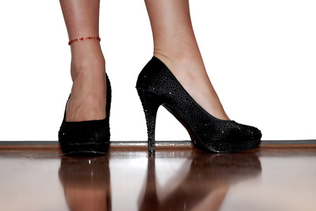 Female legs in black high-heeled shoesの写真素材