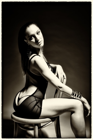 Sexy woman sitting on chairの写真素材