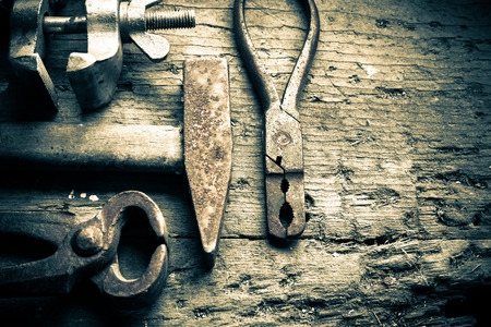 different tools on an old wooden tableの写真素材
