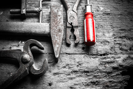 different tools on an old wooden tableの写真素材