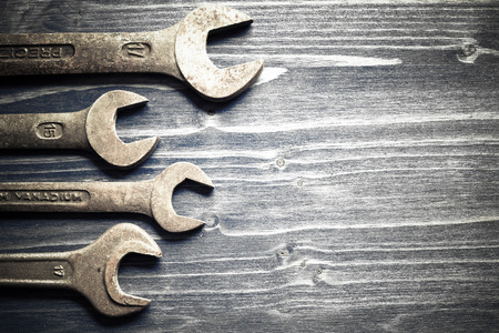 different tools on an old wooden tableの写真素材