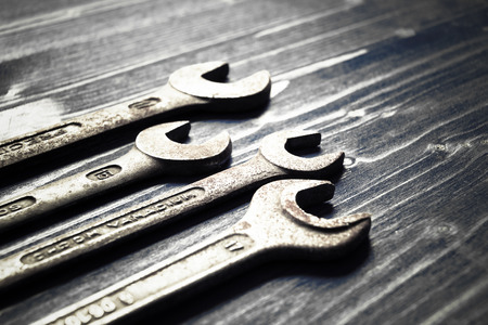 different tools on an old wooden tableの写真素材