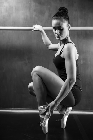 a young ballerina practicing in the hall, black and whiteの写真素材