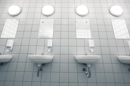 empty hand on a clean public washrooms interior