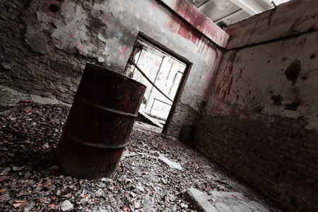 a desolate old industrial building inside, barrelの写真素材