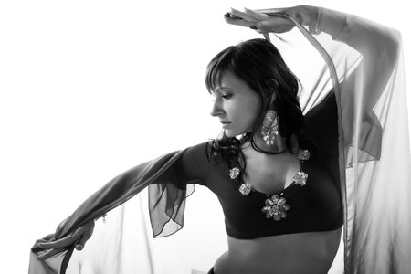 woman belly dancer, silhouette studio isolated on white backgroundの写真素材