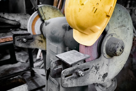 old electric grinder in a factory, protective capの写真素材