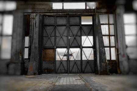 an old industrial metal gate, lot of windowの写真素材
