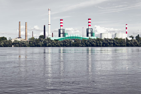 an industrial facility next to a river, sunsetのeditorial素材